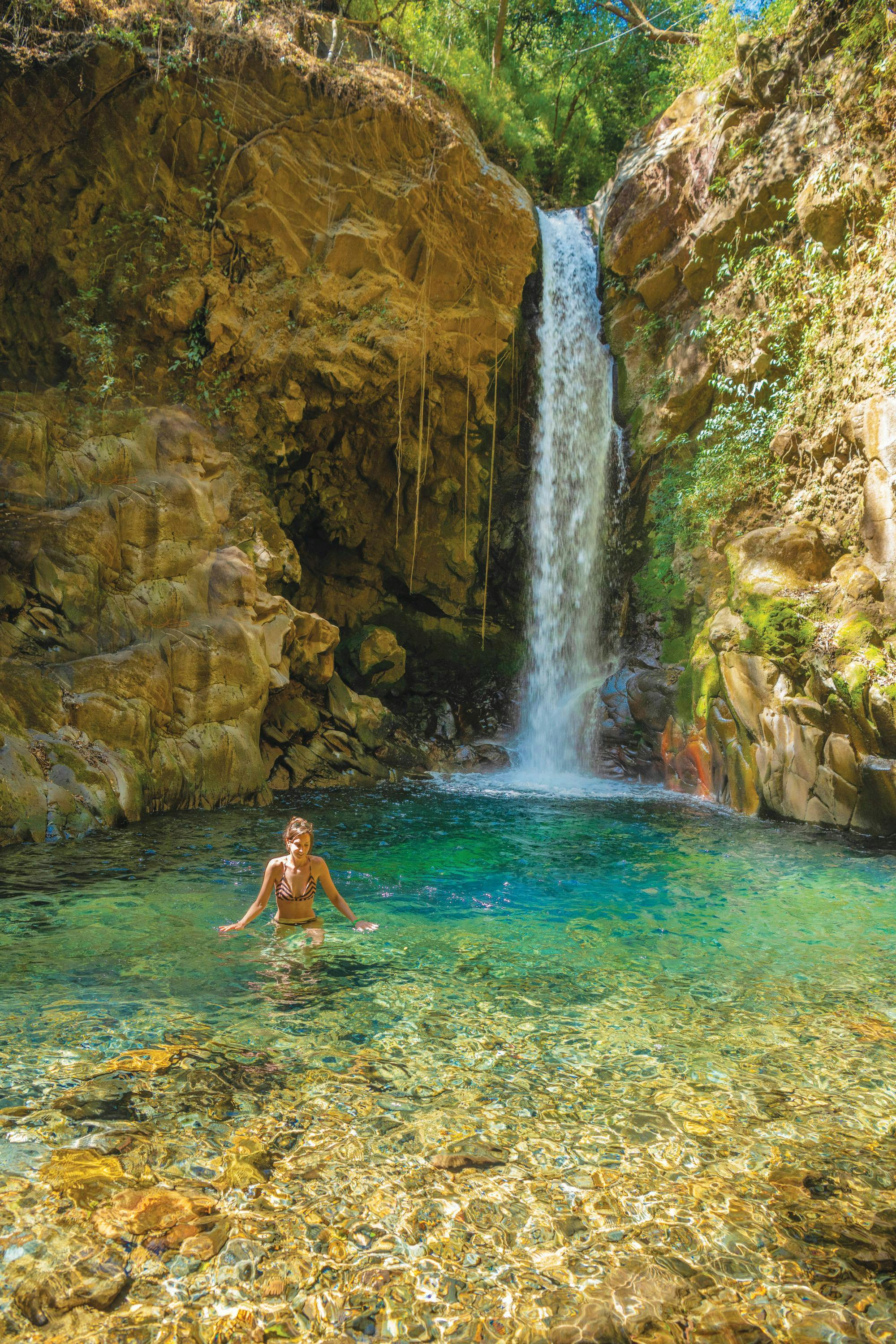 A guest swims at Guachipelin National Park, in Guanacaste, Costa Rica