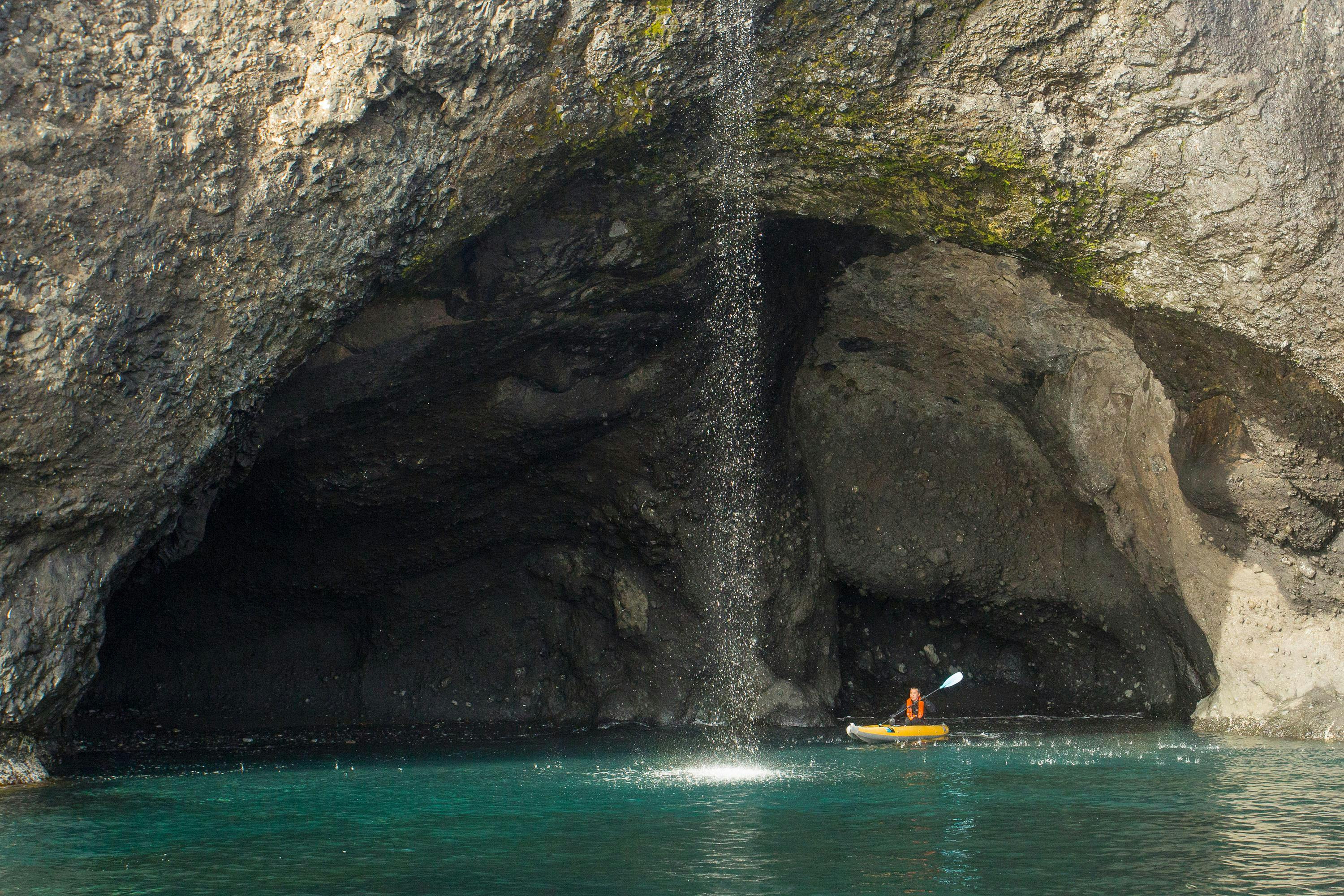 A guest from the ship National Geographic Explorer explores by kayak in Ellesmere Island, Nunavut, Canada